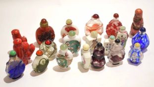 Group of Chinese glass snuff bottles, variously decorated with typical designs, (20)