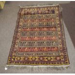 Modern Caucasian small carpet, multi-gull border and panels of geometric designs, mainly red and