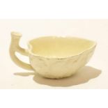 Late 18th century Wedgwood cream ware butter boat with twig handle and applied leaf decoration,