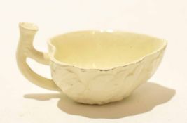 Late 18th century Wedgwood cream ware butter boat with twig handle and applied leaf decoration,
