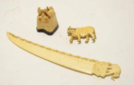 Carved ivory paper knife with elephant finial, together with a carved ivory small model of an