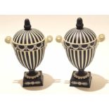 Pair of Wedgwood black basalt vases and covers on square bases, decorated in neo-classical style,