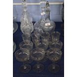 Set of glasses comprising decanter with stopper, wine glasses and champagne glasses, all with