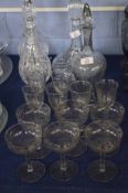 Set of glasses comprising decanter with stopper, wine glasses and champagne glasses, all with