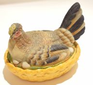 Continental porcelain hen tureen and cover, the basket base and cover modelled as a hen seated on