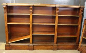 Late Victorian large parcel gilded oak bookcase fitted with three sections of adjustable shelving on