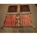 Two Caucasian saddle bag carpets, one decorated in the Bokhara manner with geometric lozenges and
