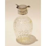 Cut glass decanter with silver collar and spout, the silver hallmarked for Chester, together with