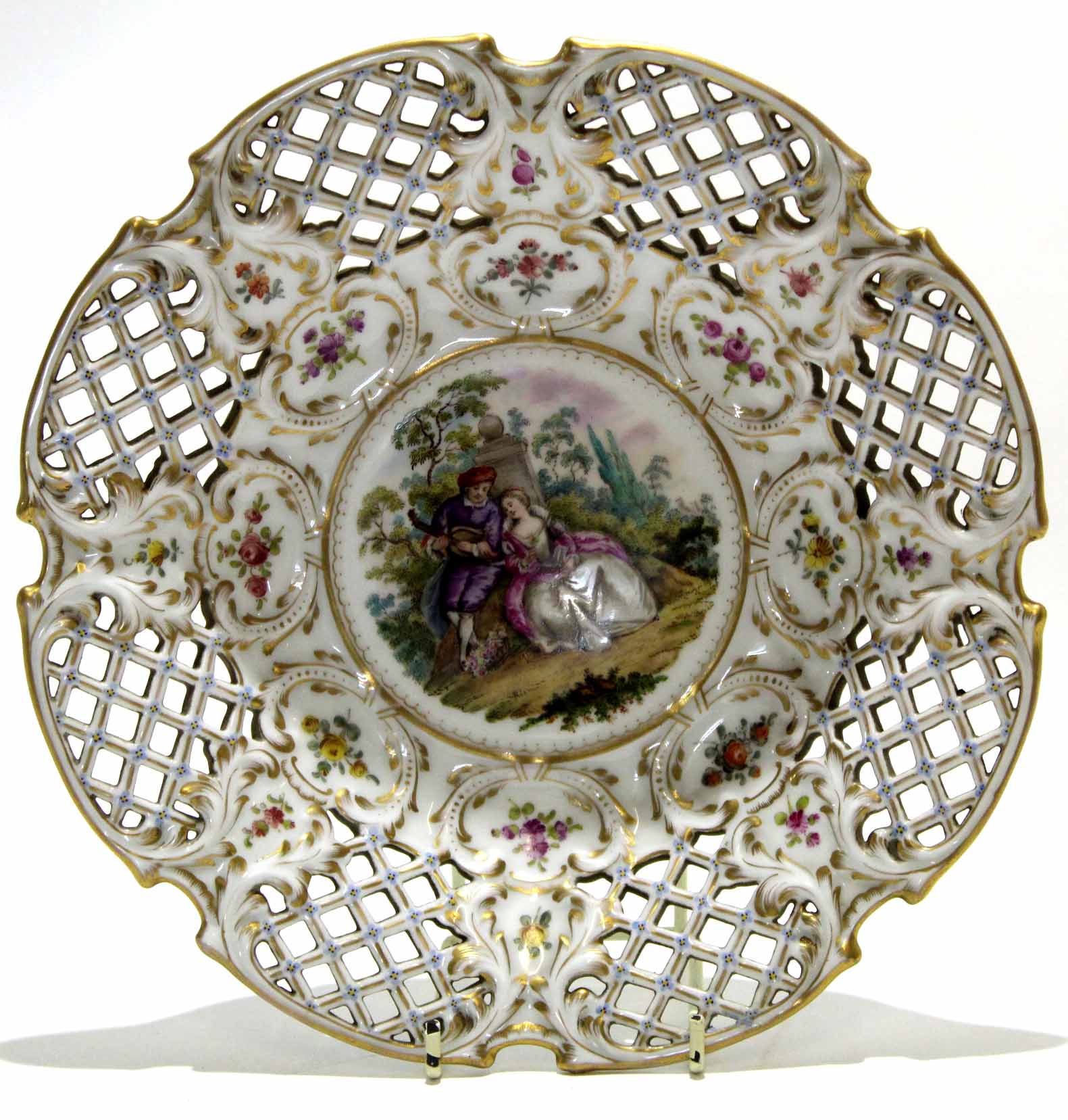 Meissen style Continental porcelain dish with reticulated borders and a pastoral scene to the