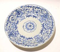 Chinese porcelain dish with a Ming style blue and white scrolling design, 25cm diam