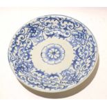 Chinese porcelain dish with a Ming style blue and white scrolling design, 25cm diam