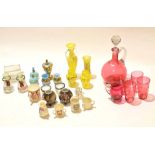 Group of coloured glass wares including a ruby glass decanter with four beakers, blue and gilt glass