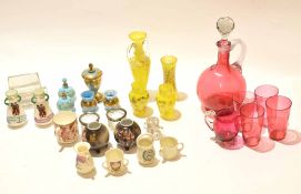 Group of coloured glass wares including a ruby glass decanter with four beakers, blue and gilt glass