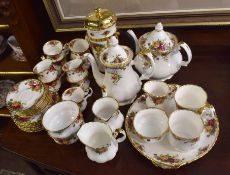 Royal Albert tea and coffee set comprising nine cups, saucers, two large coffee cans, tea pot,