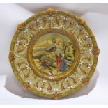 Shaped Majolica charger, the centre decorated with a fallen knight and a lady, the borders with a