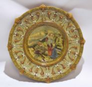 Shaped Majolica charger, the centre decorated with a fallen knight and a lady, the borders with a