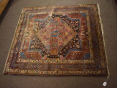 Tafrish (Iran) rug, single central lozenge in multi-gull border mainly rust, blue and black field,