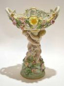 Late 19th century porcelain tazza decorated in Meissen style with two cherubs supporting a