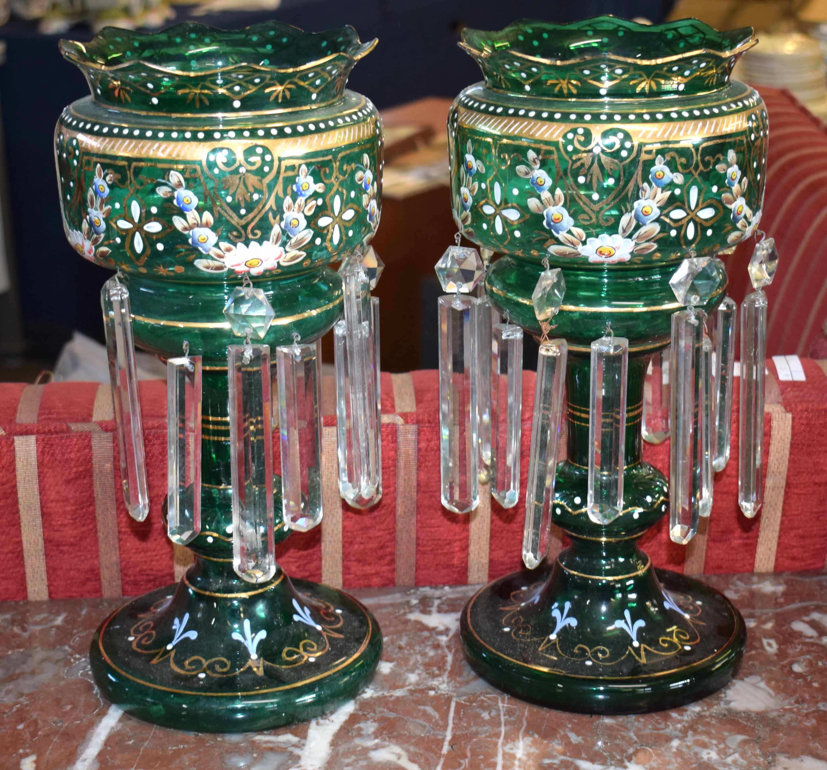 Pair of green glass lustres, decorated with garlands of flowers hand painted in gilt, pale blue