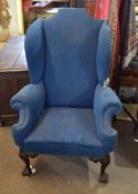 Georgian style mahogany wing armchair, raised on short front supports moulded at the knees with