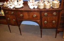 19th century mahogany bow front sideboard, the back with plain raised pediment, the front fitted