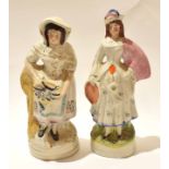 Two large Staffordshire figures, one of a fish seller, the other of a musician, 34cm high (2)