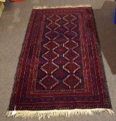 Modern Shiraz rug central geometric panel within a five-gull border, mainly red and black field,