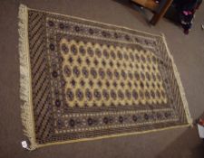 Modern Caucasian carpet, central panel of lozenges, mainly beige/brown field with pale and dark blue