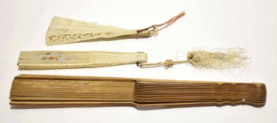 Group of three fans, two with ivory slats and one with wooden and fabric slats, 40cm long (3)