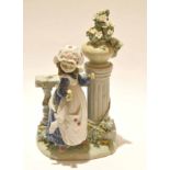 Lladro figure of a young girl alongside a classical column with floral spray, 30cm high