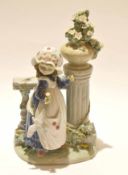 Lladro figure of a young girl alongside a classical column with floral spray, 30cm high