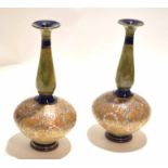 Pair of Royal Doulton baluster ware vases with slender necks, decorated with a Slater's Patent