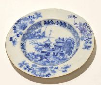 English Delft plate decorated with a pagoda within a border of floral sprays, 23cm diam