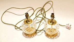 Two Waterford cut glass lamps with brass fittings and glass reservoir (2)