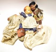 Bag containing an assortment of dolls and dolls clothing (qty)