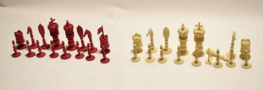 Collection of carved ivory or bone chess pieces in white and stained red, (33)