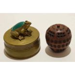Brass metal circular box with frog finial and emerald type stone to back, together with an
