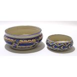 Two Poole Pottery bowls both with a geometric design, probably by Truda Carter, largest bowl 23cm