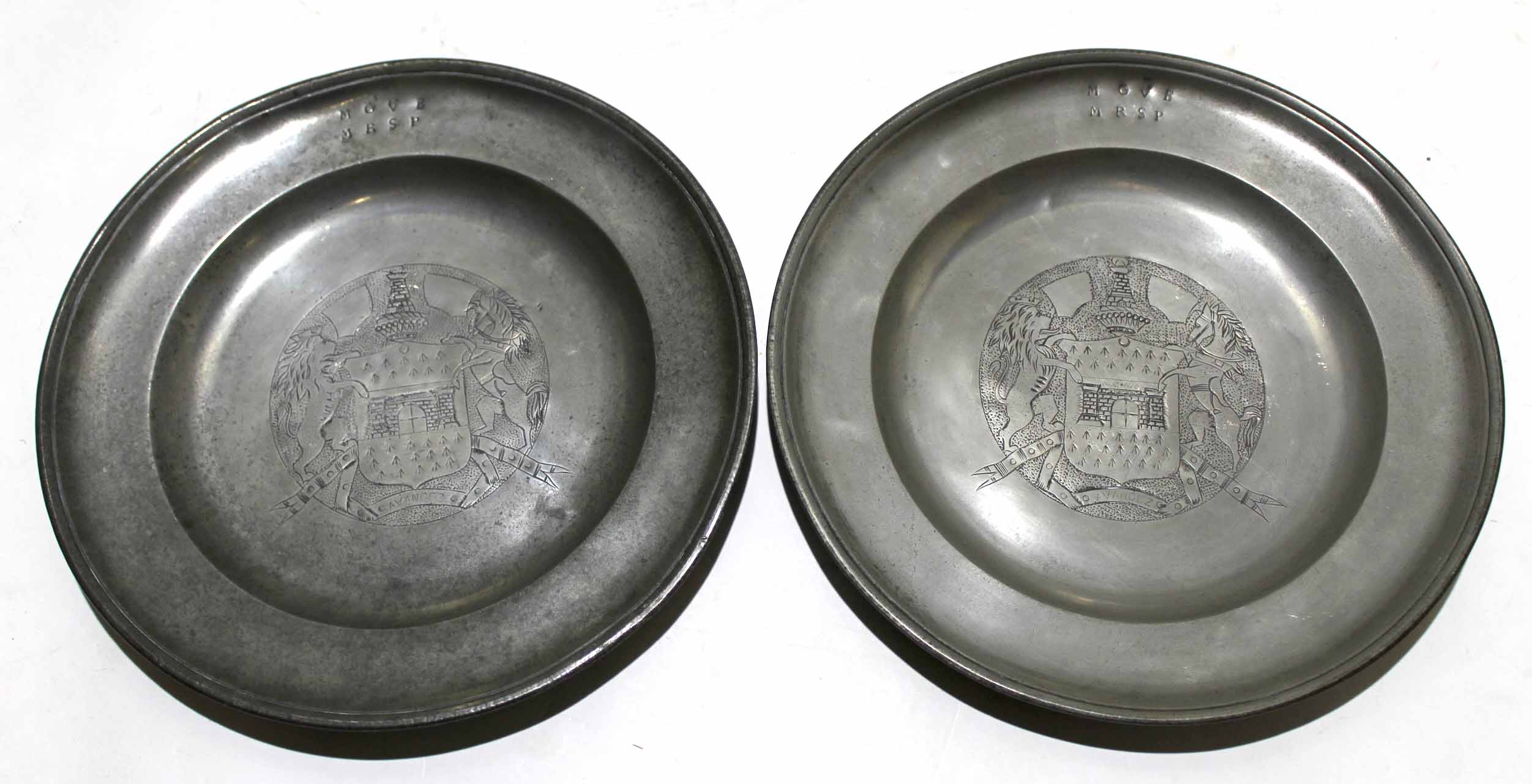 Two pewter plates with faded touch marks and armorial centre panels, 32cm diam