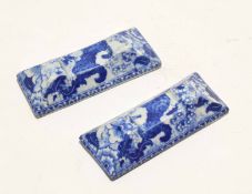 Pair of flow blue porcelain knife rests, 9cm long