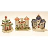 Group of three Staffordshire models of cottages all decorated in typical fashion, (3)