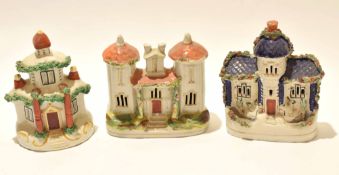 Group of three Staffordshire models of cottages all decorated in typical fashion, (3)