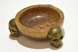 Unusual onyx bowl with three applied brass skulls as feet, 16cm diam