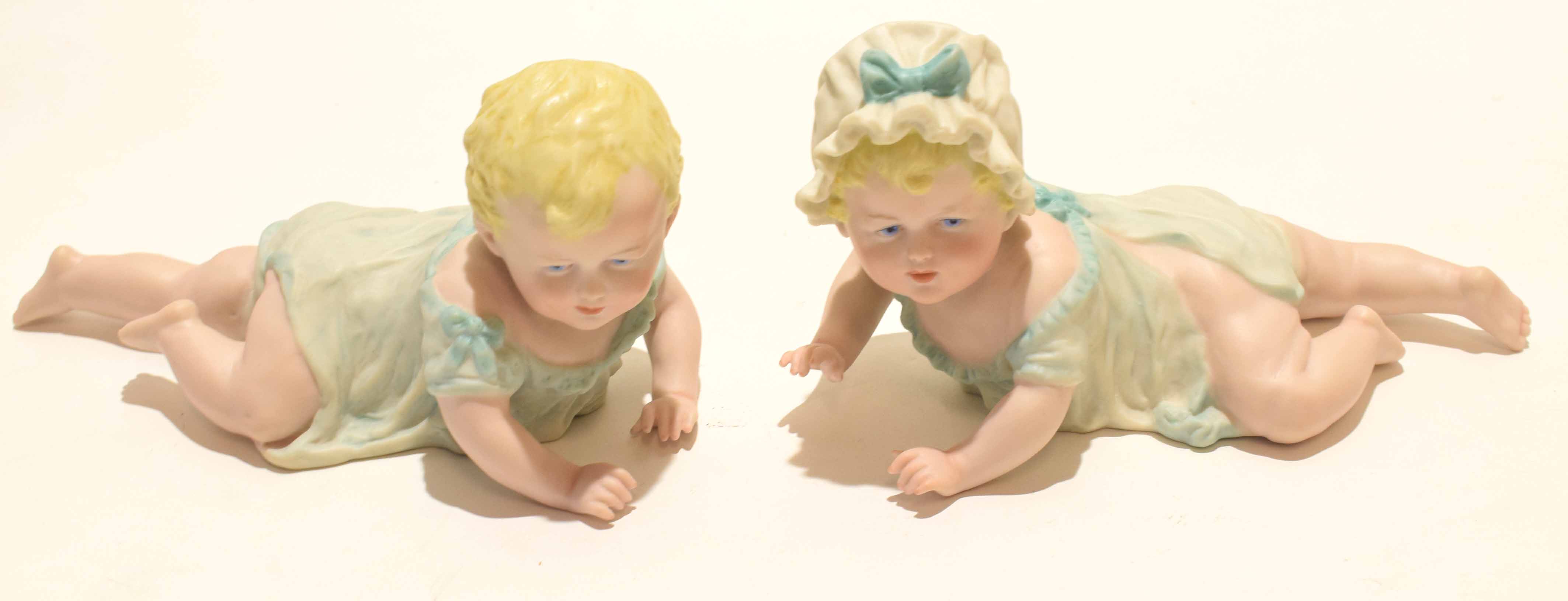 Early 20th century bisque porcelain model of a boy and girl