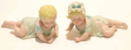 Early 20th century bisque porcelain model of a boy and girl