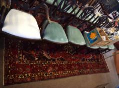 Large Caucasian rug, red ground decorated in blue, brown and white, multi-gull border, 301cm x 202cm