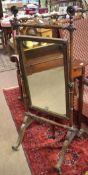 19th century mahogany cheval mirror of small proportions, ring turned frame and splayed legs with