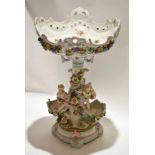 Late 19th century Continental porcelain tazza, with shaped circular base with three cherubs above