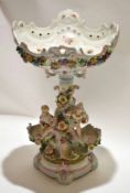 Late 19th century Continental porcelain tazza, with shaped circular base with three cherubs above