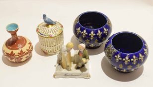 Group of pottery and porcelain items including a Paris porcelain jar and cover with bird finial, a